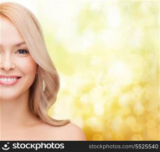 heath and beauty concept - closeup of clean face and shoulders of beautiful young woman
