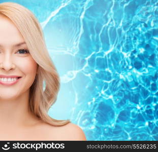 heath and beauty concept - closeup of clean face and shoulders of beautiful young woman