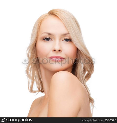 heath and beauty concept - closeup of clean face and shoulders of beautiful young woman