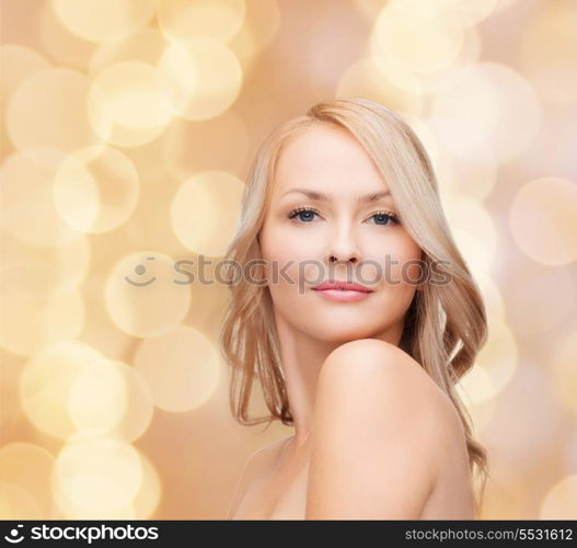 heath and beauty concept - closeup of clean face and shoulders of beautiful young woman