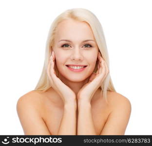 heath and beauty concept - face of beautiful woman touching her face skin