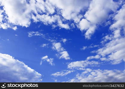 Heaven. Cloudscape of light white clouds around blue sky