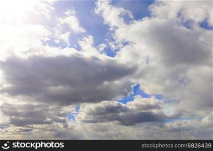 Heavenly blue sky with bright sunshine and light beams