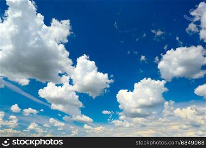 Heavenly landscape. Cumulus clouds in a blue sky.