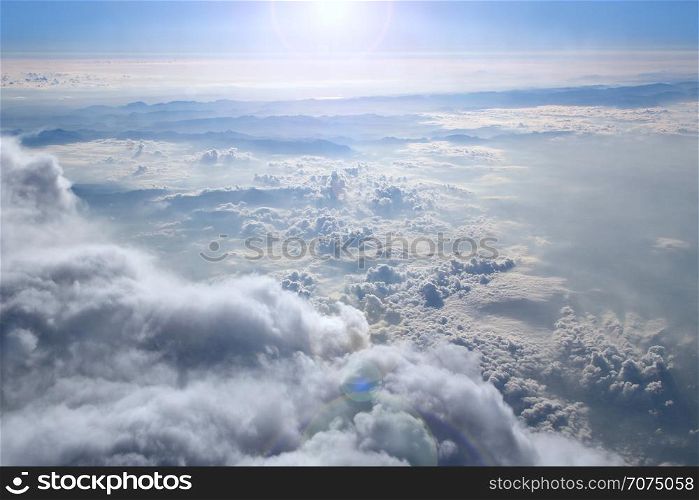 Heavenly landscape with shining sun. Big white clouds on blue sky. Beautiful white clouds on blue sky background. White clouds on boundless sky. Blue heaven with white clouds. Landscape and blue sky. Heavenly landscape with shining sun. Big white clouds on blue sky