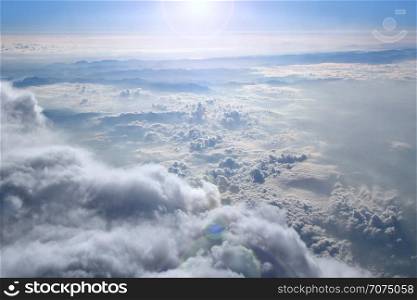 Heavenly landscape with shining sun. Big white clouds on blue sky. Beautiful white clouds on blue sky background. White clouds on boundless sky. Blue heaven with white clouds. Landscape and blue sky. Heavenly landscape with shining sun. Big white clouds on blue sky