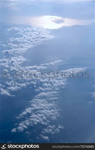 Heavenly landscape with shining sun. White clouds on blue sky. Beautiful white clouds on blue sky background. White clouds on boundless sky. Blue sky with white clouds. Landscape and blue sky. Heavenly landscape with shining sun. White clouds on blue sky