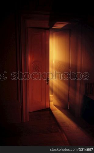 Heavenly rays of light behind the door