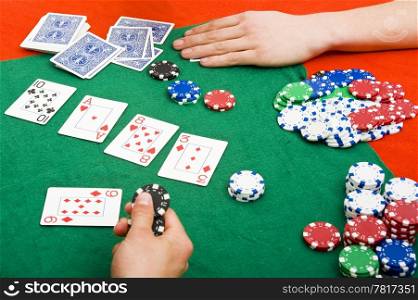 Heavy action on a poker table after the flop, with players going all in