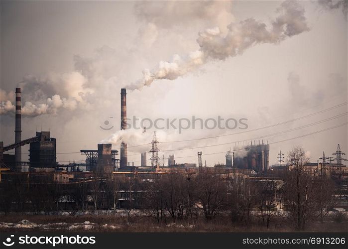 Heavy industry air pollution concept. Metallurgical plant smoke chimney