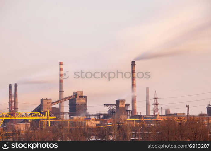 Heavy industry air pollution concept. Metallurgical plant smoke chimney