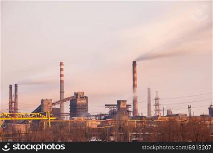 Heavy industry air pollution concept. Metallurgical plant smoke chimney