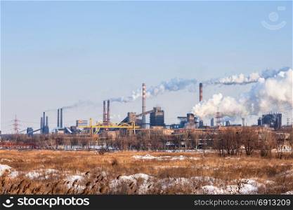 Heavy industry air pollution image. Metallurgical plant smoke chimney