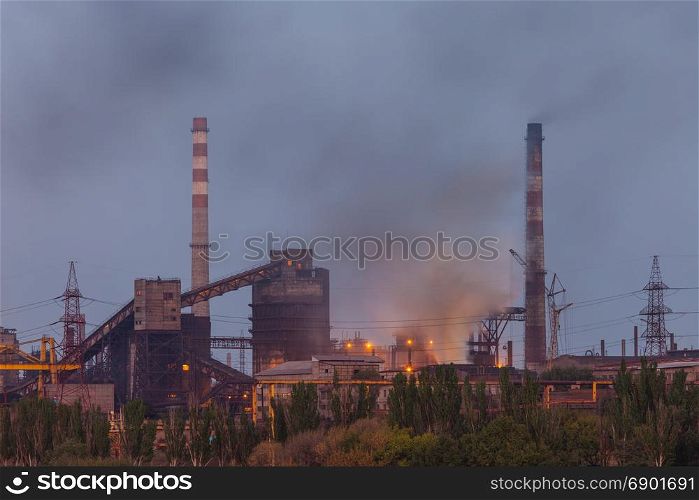 Heavy industry air pollution. Metallurgical plant smoke chimney