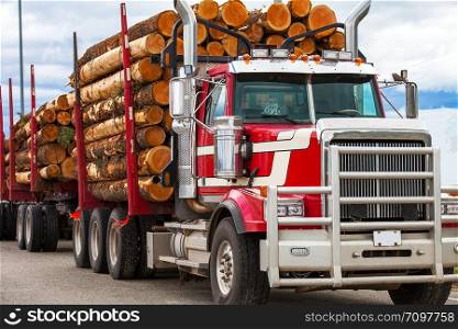 Heavy loaded timber transport truck in British Columbia Canada. Heavy loaded timber transport truck in British Columbia