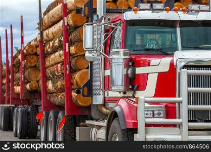 Heavy loaded timber transport truck in British Columbia Canada. Truck timber transport in British Columbia Canada