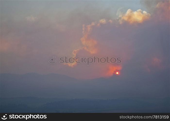 heavy smoke from High Park wildfire obscuring the sun and sky over Rocky Mountains near Fort Collins, Colorado, June 10, 2012