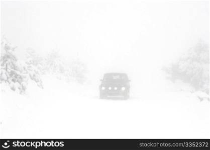 heavy snow on the road in the foggy day