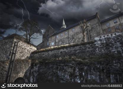 Heavy thunderstorm with lightning. fortress of Akershus - a castle in Oslo, the capital of Norway.. Heavy thunderstorm with lightning.