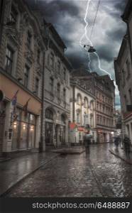 Heavy thunderstorm with lightning. old houses on Riga street. Latvia. Europe. Heavy thunderstorm with lightning.