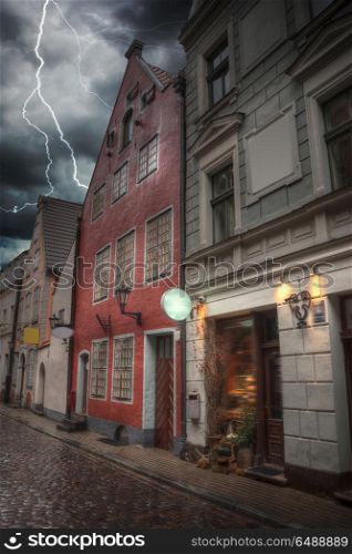 Heavy thunderstorm with lightning. old houses on Riga street. Latvia. Europe. Heavy thunderstorm with lightning.