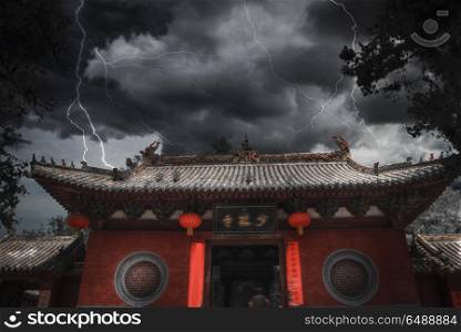 Heavy thunderstorm with lightning. Shaolin is a Buddhist monastery in central China. . Heavy thunderstorm with lightning.