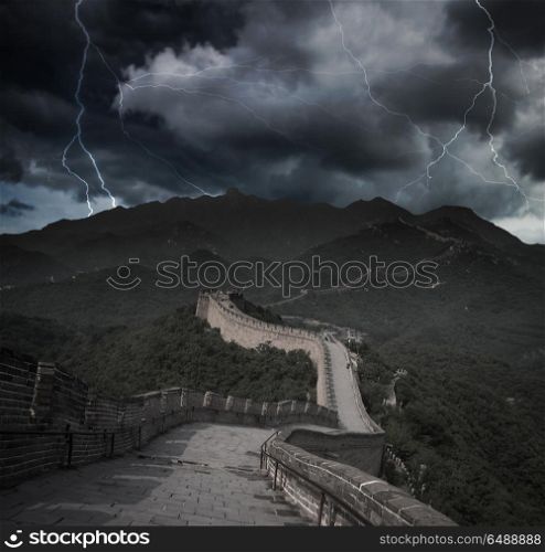 Heavy thunderstorm with lightning. View of the great Chinese wall and mountains.. Heavy thunderstorm with lightning.