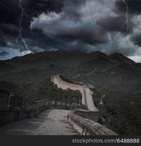 Heavy thunderstorm with lightning. View of the great Chinese wall and mountains.. Heavy thunderstorm with lightning.