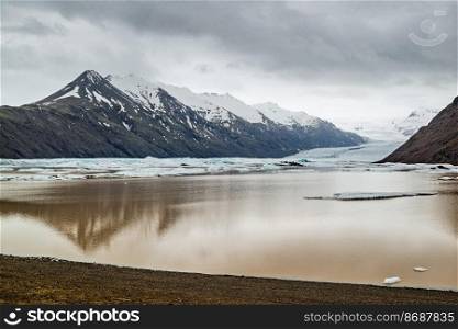 Heinabergsjokull glacier and lagoon in Iceland in a cloudy day. Heinabergsjokull glacier and lagoon in Iceland