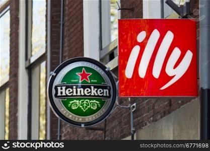 Heineken and Illy advertising signs at a cafe restaurant