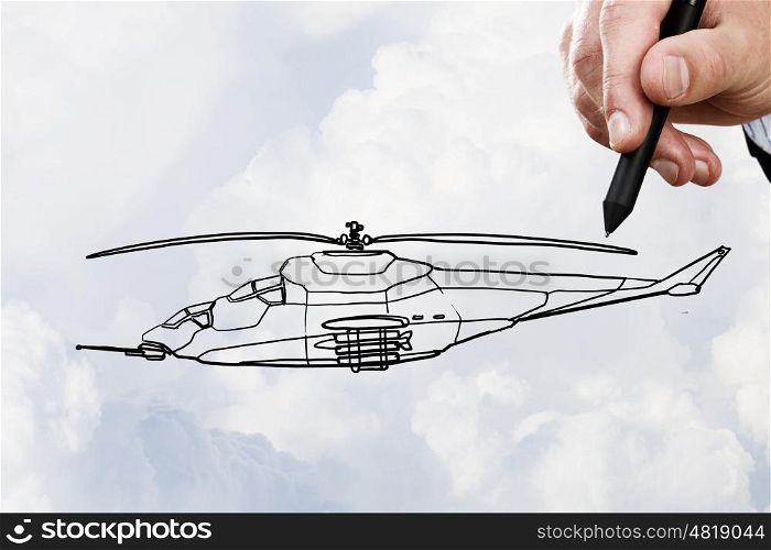 Helicopter design. Person hand drawing helicopter model ob sky background