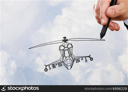 Helicopter design. Person hand drawing helicopter model ob sky background