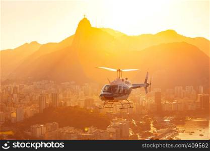 helicopter flying over Rio de Janeiro at the evening light. Brazil
