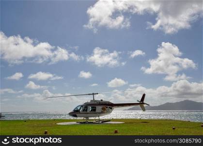 Helicopter landing on a tropical island