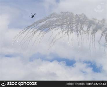 Helicopter releasing anti-missile flares