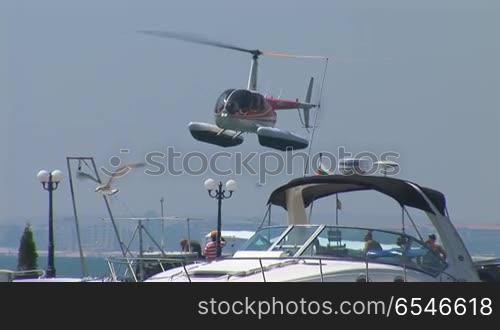 helicopter sits in the port