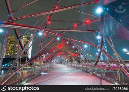 Helix bridge at night in Singapore. Travel landmark of Singapore in night.