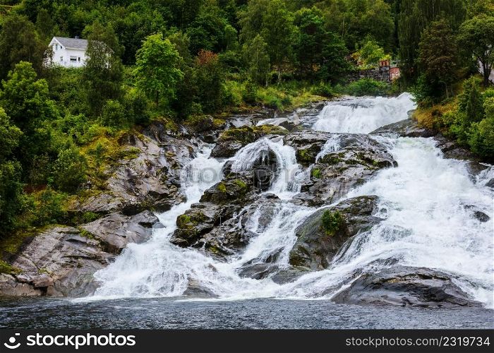 Hellesylt Fossen waterfall in the area Geirangerfjord in village Hellesylt