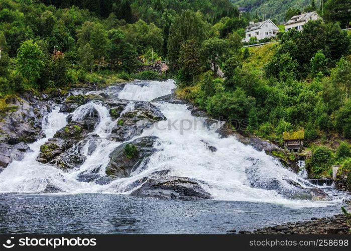 Hellesyltfossen waterfall in the area Geirangerfjord in village Hellesylt