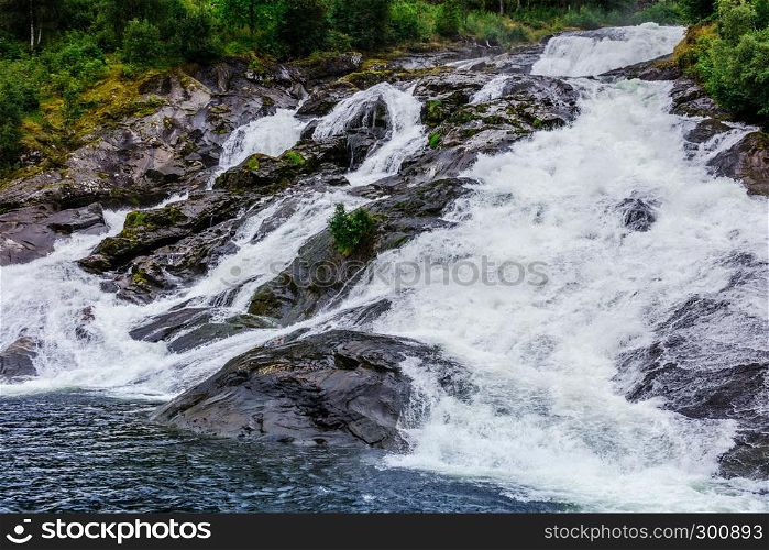 Hellesyltfossen waterfall in the area Geirangerfjord in village Hellesylt