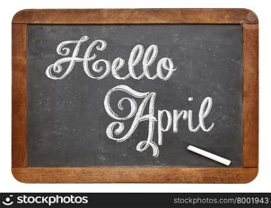 Hello April sign - white chalk text on an isolated vintage slate blackboard