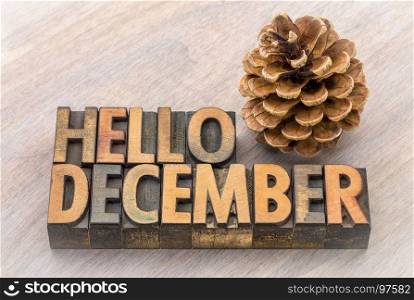 Hello December greeting card - vintage letterpress wood type blocks against grained wood