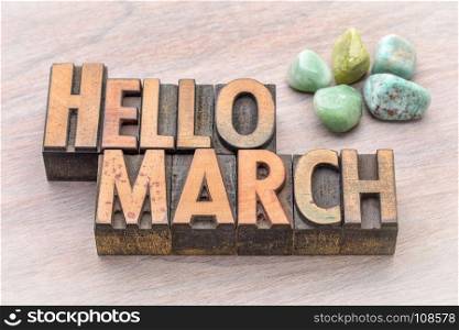 Hello March in vintage letterpress wood type with green gemstone crystals