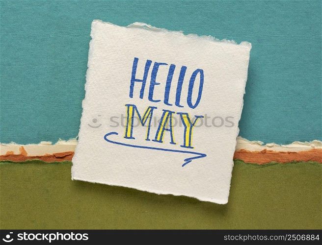Hello May  greeting note  - handwriting on a white handmade paper against colorful abstract landscape, calendar concept