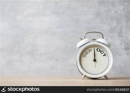 Hello October Changed from September  month with vintage alarm clock on table background. Calendar, Monthly, New Start, Resolution, Goals, Plan, Action and Mission Concept