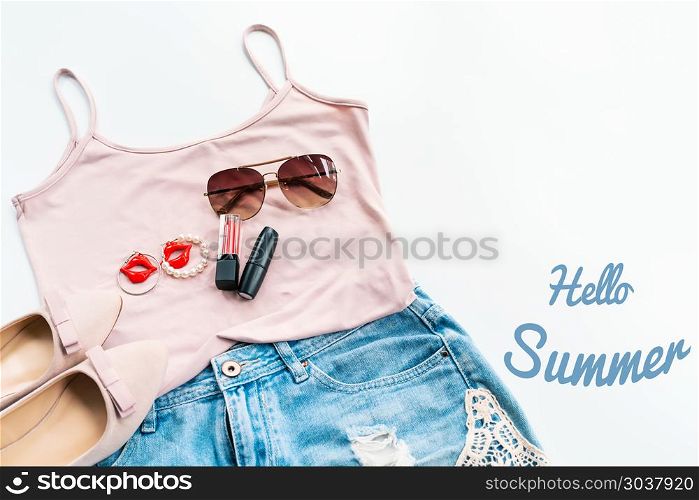 Hello summer concept. Female clothes, and accessories layout on . Hello summer concept. Female clothes, and accessories layout on white background. Flat lay. Top View