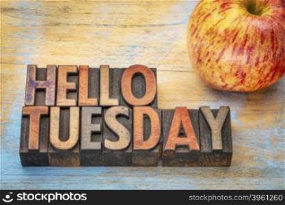 Hello Tuesday - text in vintage letterpress wood type with an apple
