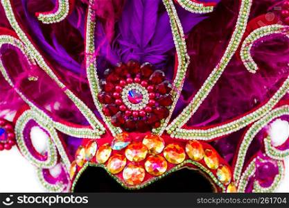 helmet decorated with bright stones and feathers for carnival ultraviolet tones
