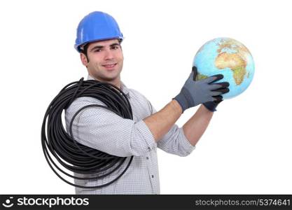 helmeted electrician holding globe