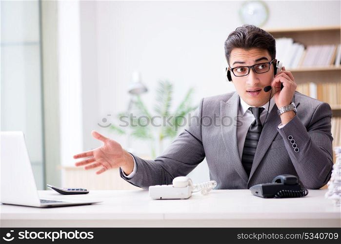 Helpdesk operator talking on phone in office